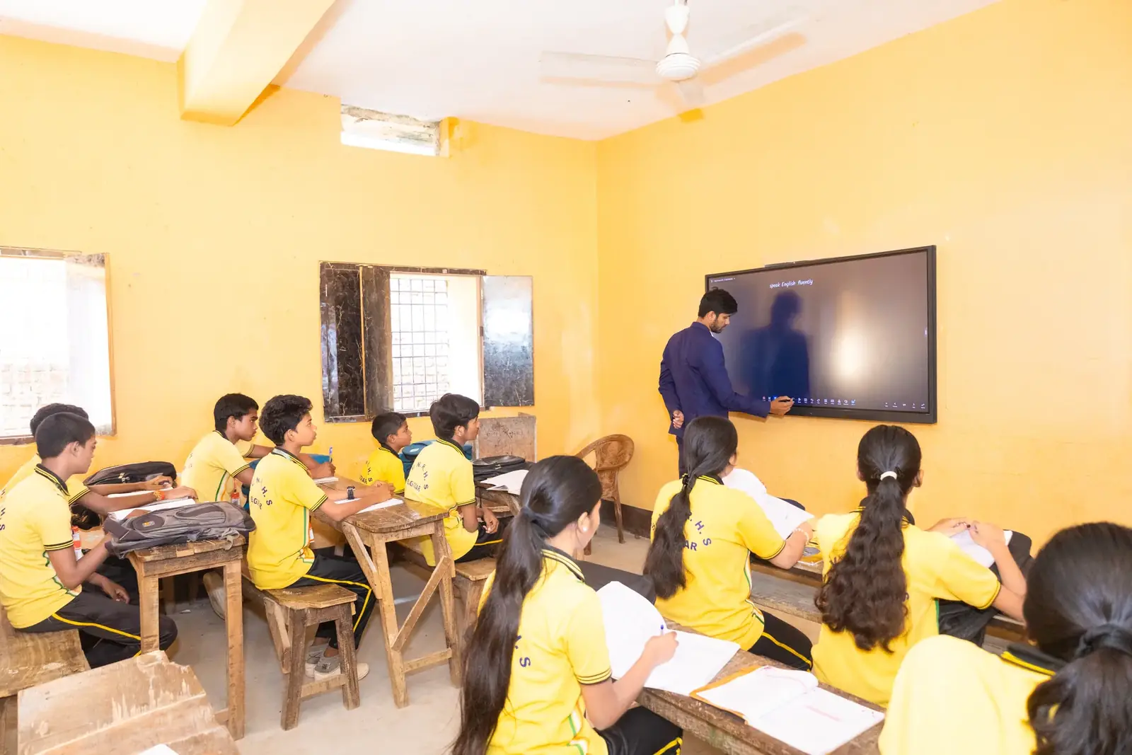 A class following a lesson on the digital board